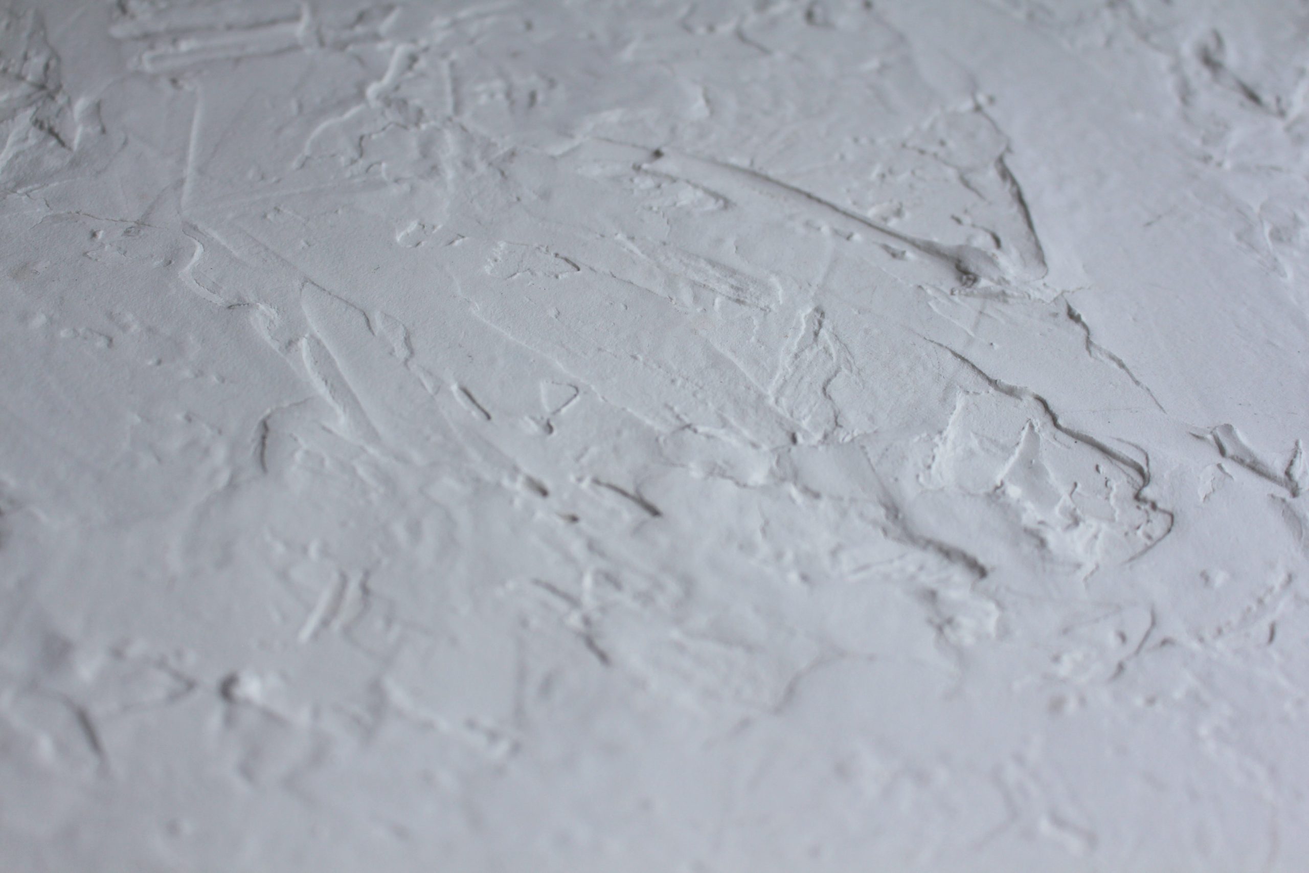Surface plâtre blanc texturé grain rugueux
